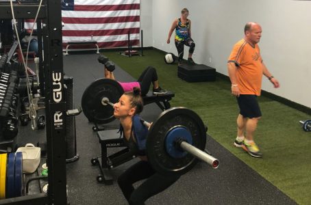 Lifting Weights at a Small Group Fitness class